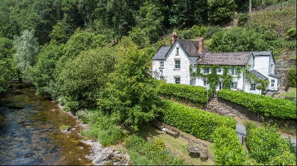 A gorgeous home in an elevated setting overlooking the River Barle sitting in 15 acres, of