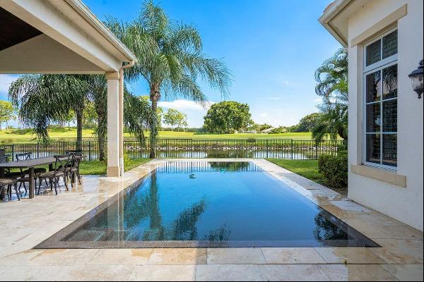 You will not be disappointed with this one-story, heated pool estate, which offers extraor