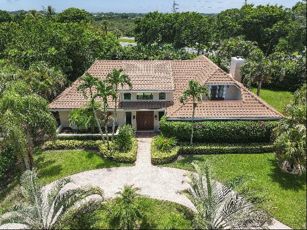 Welcome to your slice of paradise in the heart of Tequesta. Nestled within the serene comm