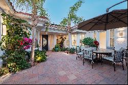 Privately situated on an over-sized lot in guard gated Mira Vista