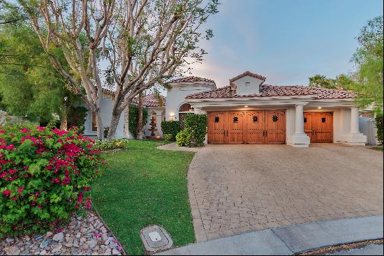 Privately situated on an over-sized lot in guard gated Mira Vista