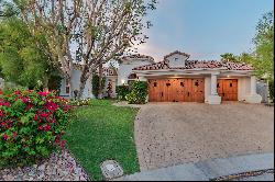 Privately situated on an over-sized lot in guard gated Mira Vista