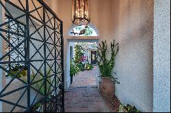 Privately situated on an over-sized lot in guard gated Mira Vista