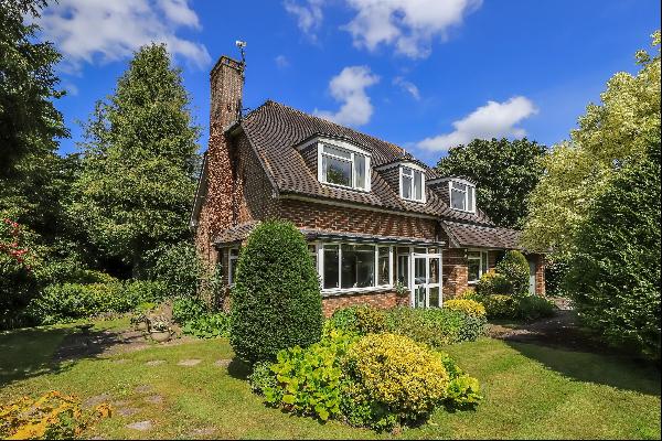 A detached house located with picturesque gardens bordering the Wallop Brook in this sough