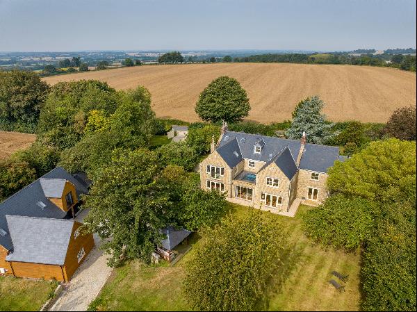 An exceptional and substantial family home with separate annexe and extensive garaging set