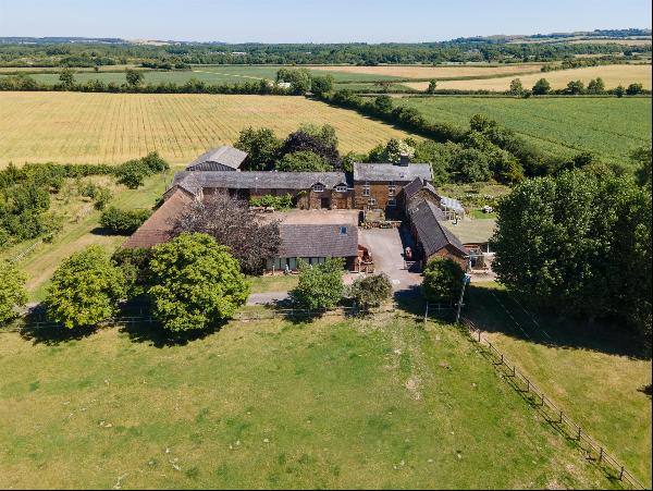 An enchanting South Warwickshire property in a private setting with a range of outbuilding