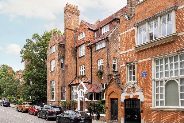 A spacious garden flat in a handsome redbrick building on Melbury Road, W14.