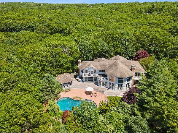 Situated on one of the highest elevations in Southampton overlooking Little Peconic Bay, t