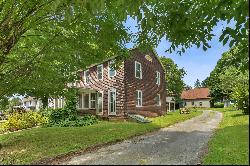 Enchanting 6-bed, 2-bath antique home with 2-story stone barn, nestled in downto