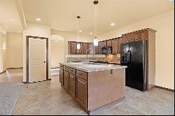 3 car garage, covered patio with sun screen