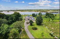 Nantucket Colonial with 100' of water frontage and private dock.