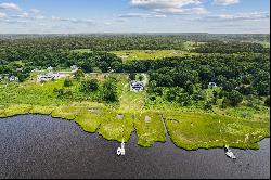 Nantucket Colonial with 100' of water frontage and private dock.