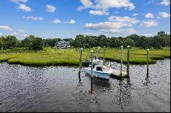 Nantucket Colonial with 100' of water frontage and private dock.