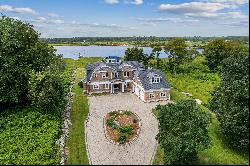 Nantucket Colonial with 100' of water frontage and private dock.