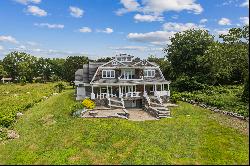 Nantucket Colonial with 100' of water frontage and private dock.