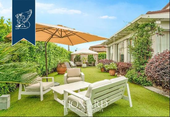 Luxury villa with a stunning garden and private parking spaces for sale in Versilia