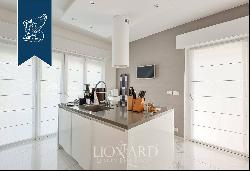 Stunning apartment in a designer villa for sale between Forte dei Marmi and Marina di Mass