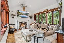 Retreat to a riverfront oasis in this luxurious Breckenridge home. 