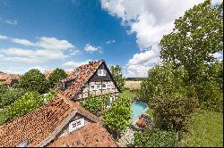 Exclusive half-timbered house with a dream garden in an idyllic location on the