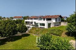 ARBONNE, VAST CONTEMPORARY HOUSE WITH A PANORAMIC VIEW OF THE MOUNTAINS