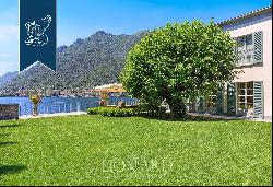 Wonderful waterfront villa by Lake Como with garden, infinity pool and dock with custom-ma