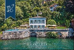 Wonderful waterfront villa by Lake Como with garden, infinity pool and dock with custom-ma