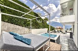 Exclusive apartment with large terrace, jacuzzi & partial lake view for sale in Locarno-M