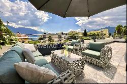 Exclusive apartment with large terrace, jacuzzi & partial lake view for sale in Locarno-M