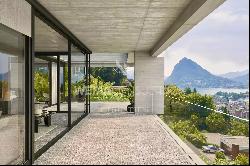 Lugano-Viganello: modern penthouse apartment with large covered terrace & lake view for s