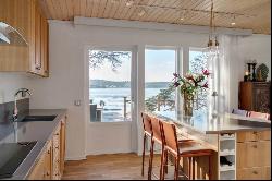 Southwest-facing waterfront property featuring stunning sunsets over the bay