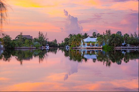 Corner lot canal front home with double water frontage and 2 docks