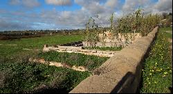 Well located plot with two ruins for sale near Salgados Golf in Algarve near Praia Grande