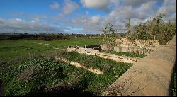 Well located plot with two ruins for sale near Salgados Golf in Algarve near Praia Grande