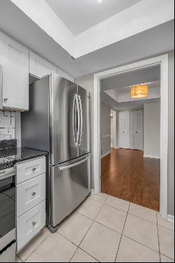 Move in ready two bedroom, two bathroom top floor condo at The Oaks! Convenientl