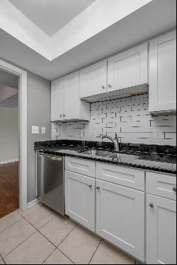 Move in ready two bedroom, two bathroom top floor condo at The Oaks! Convenientl