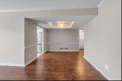 Move in ready two bedroom, two bathroom top floor condo at The Oaks! Convenientl