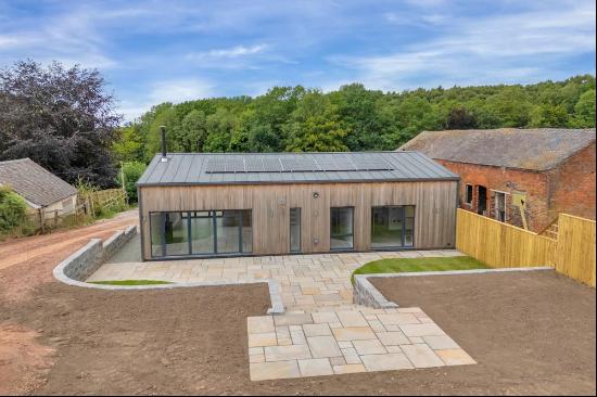 Four detached and bespoke barn conversions, located on the edge of Downs Banks just outsid