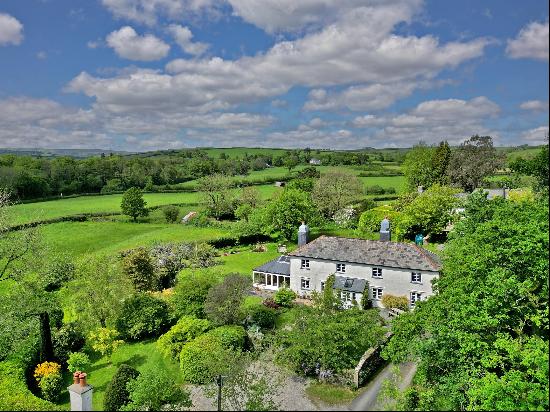 An enchanting, unlisted 18th century house in a magical setting.