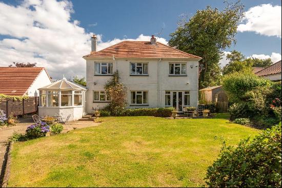 A four bedroom family home with a south facing garden in a prime Cramond address.