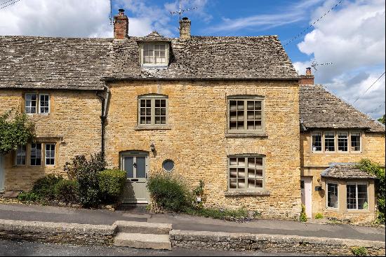 Pretty Cotswold stone cottage in a highly sought-after village.