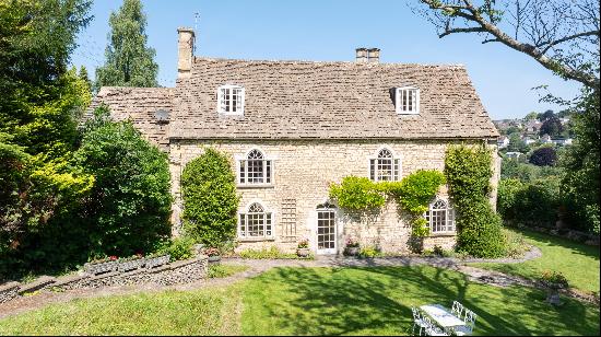 A stunning period house with a wealth of character, set in extensive private gardens on th