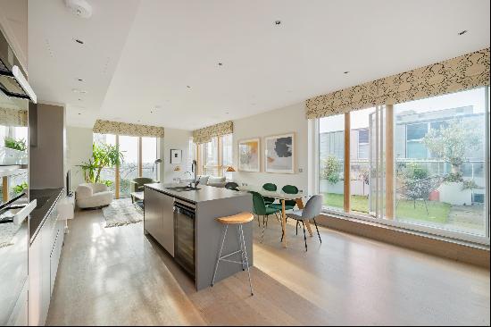 An extraordinary 2 bedroom penthouse with roof terrace and parking in Queens Park Place, N