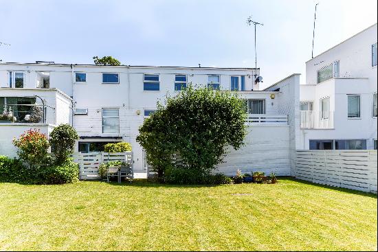 This bright and modern family home with access to a beautiful communal garden is available