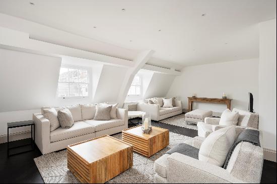 An immaculate duplex apartment with lift access on the top two floors of a Grade II listed