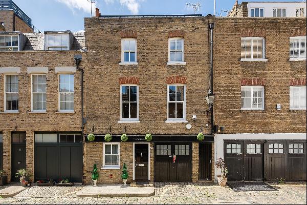 A beautifully presented freehold mews house with a roof terrace offering enviable views ov