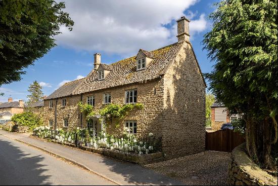 A beautiful Grade II listed farmhouse with cottage, a range of outbuildings and 10 acres