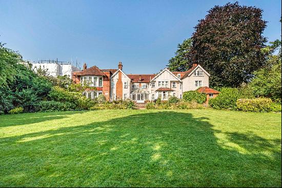 A substantial house and large gardens in this prime residential road close to schools.