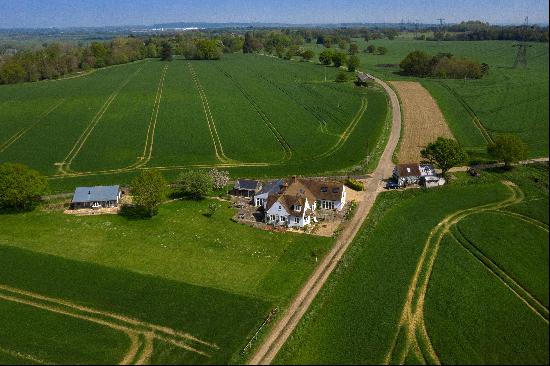 A house, garden cottage, and garage/workshop set in a wonderfully secluded location amidst