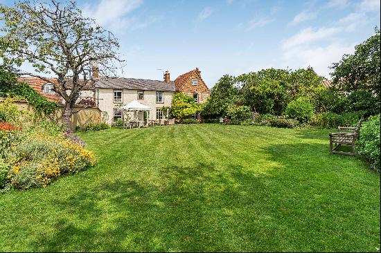 A superb Grade II listed family home set within beautiful gardens and with the benefit of 