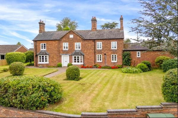 A charming 4 bedroom detached house set in ¼ of an acre of pretty gardens in the heart of 